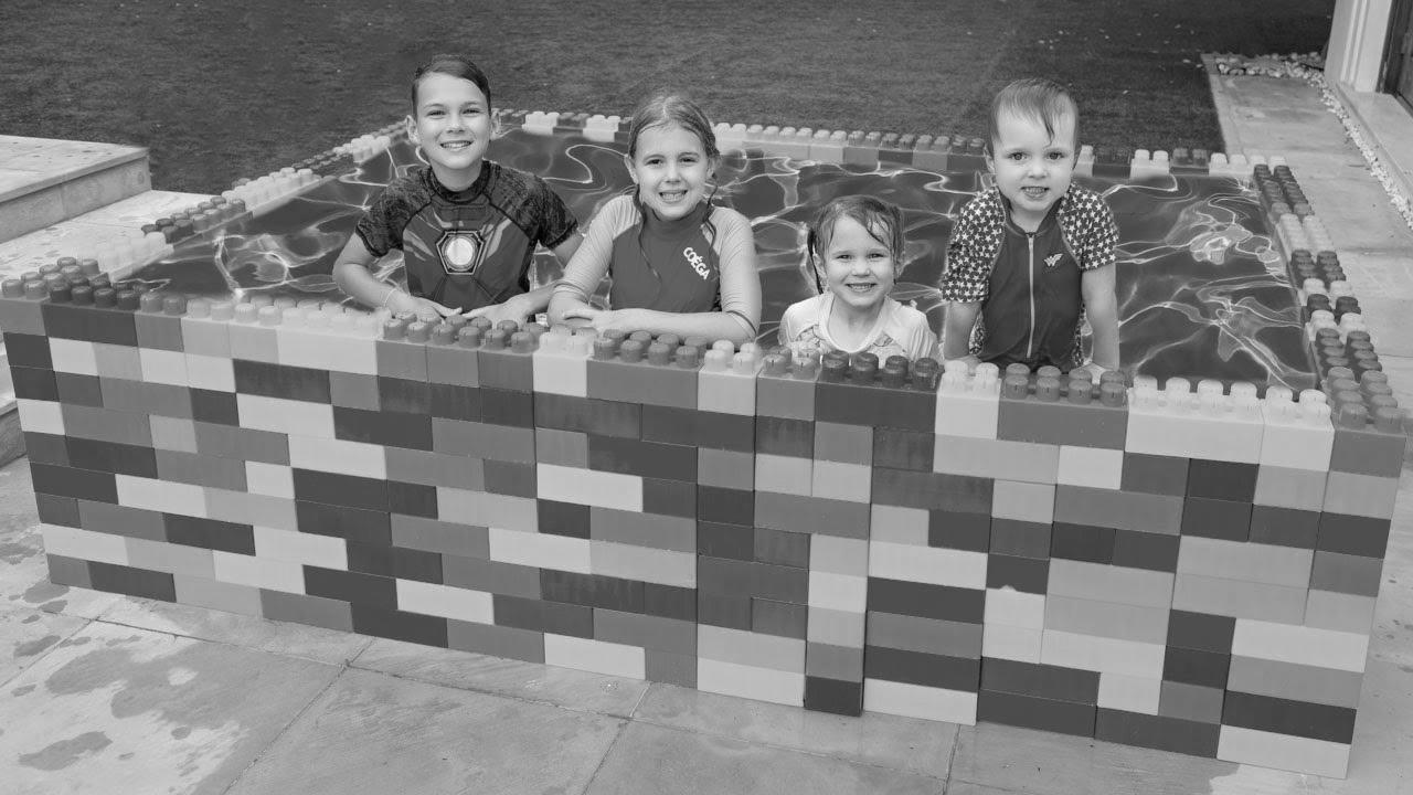 Five Children Find out how to Swim in the Youngsters Pool and Plays with Fun Water Toys